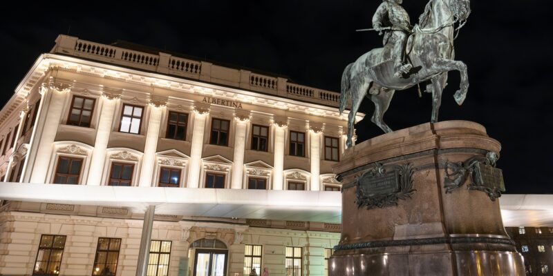 Evening view to Erzherzog Albrecht equestrian monument near famous Albertina museum palace in Vienna, Austria. January 2022. High quality photo